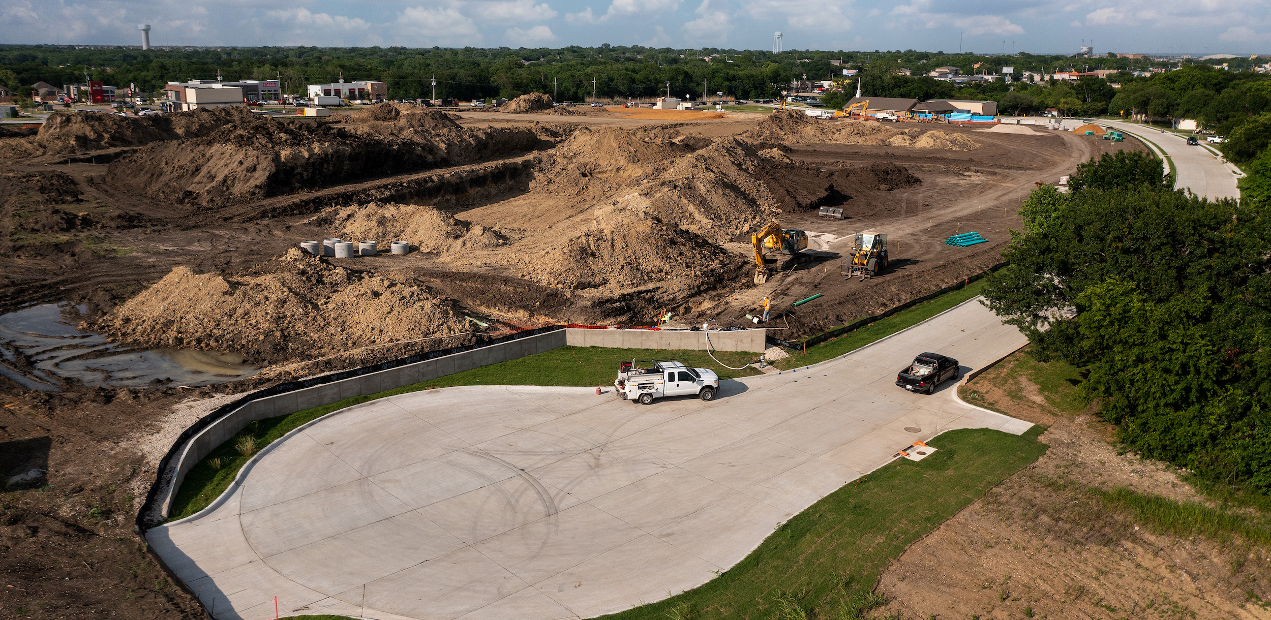 Aerial view of new construction with dirt being moved